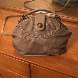 Unlabeled tan pleather purse